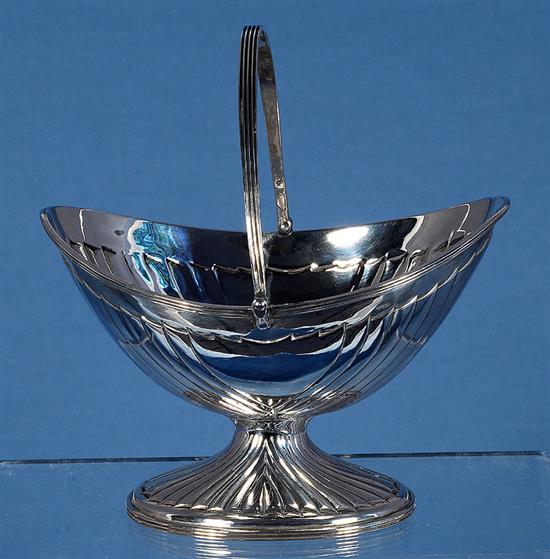 A Victorian silver oval boat shaped sugar basket, by John Newton Mappin, height over handle 172mm, weight